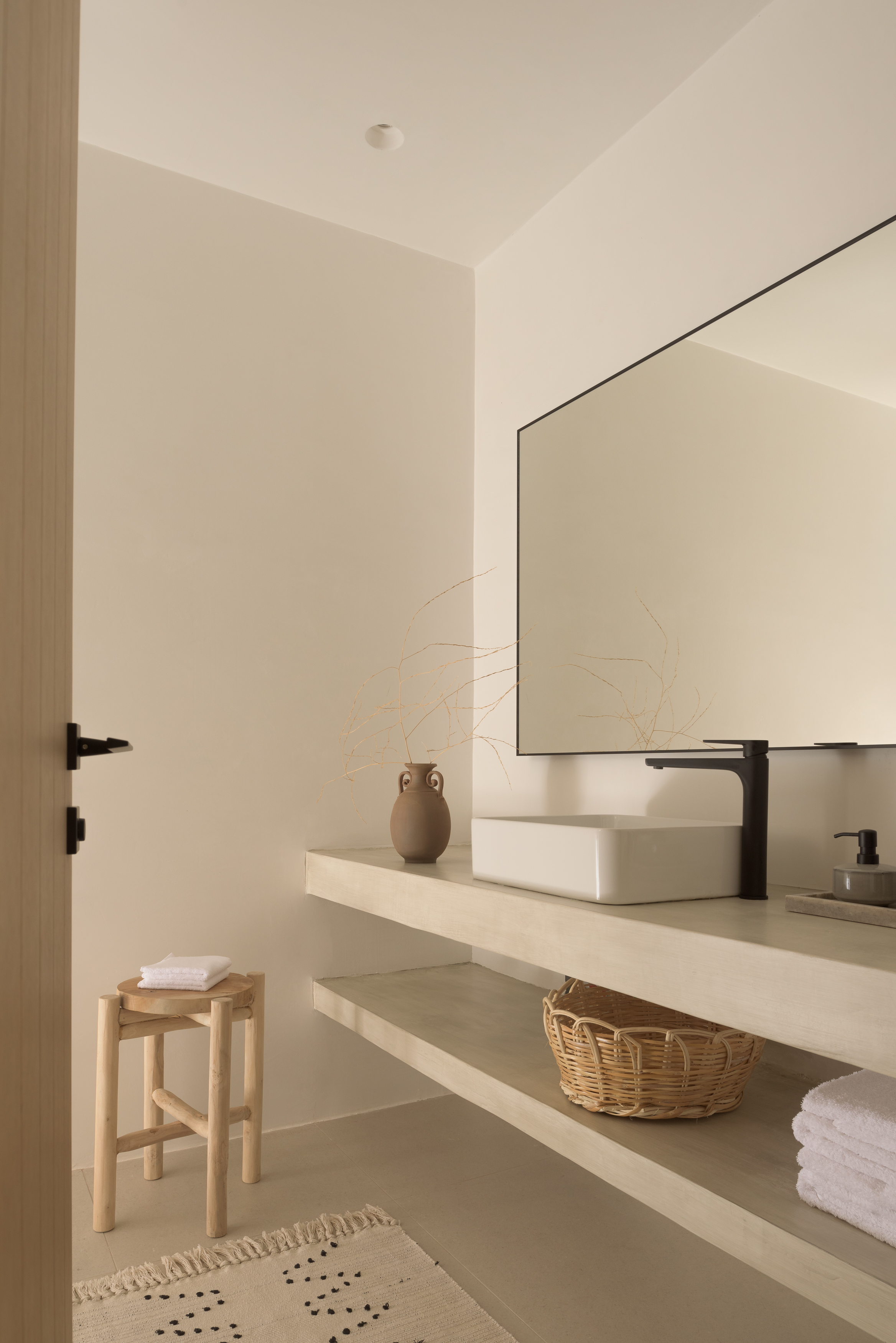 Elegant design and thoughtful details create a perfectly curated bathroom space.