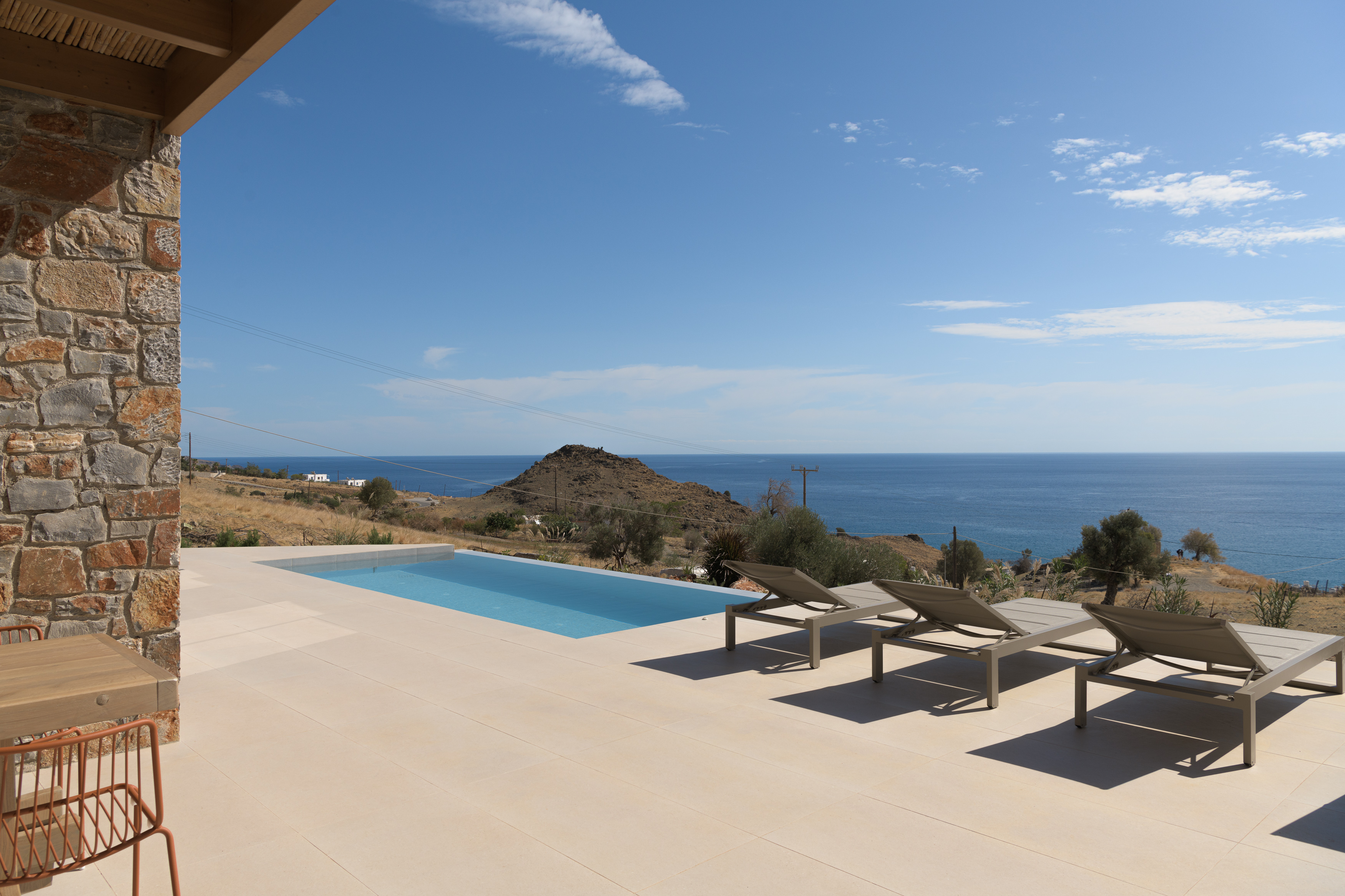 Welcome to Kyma Villa, where serene landscapes meet luxurious comforts.