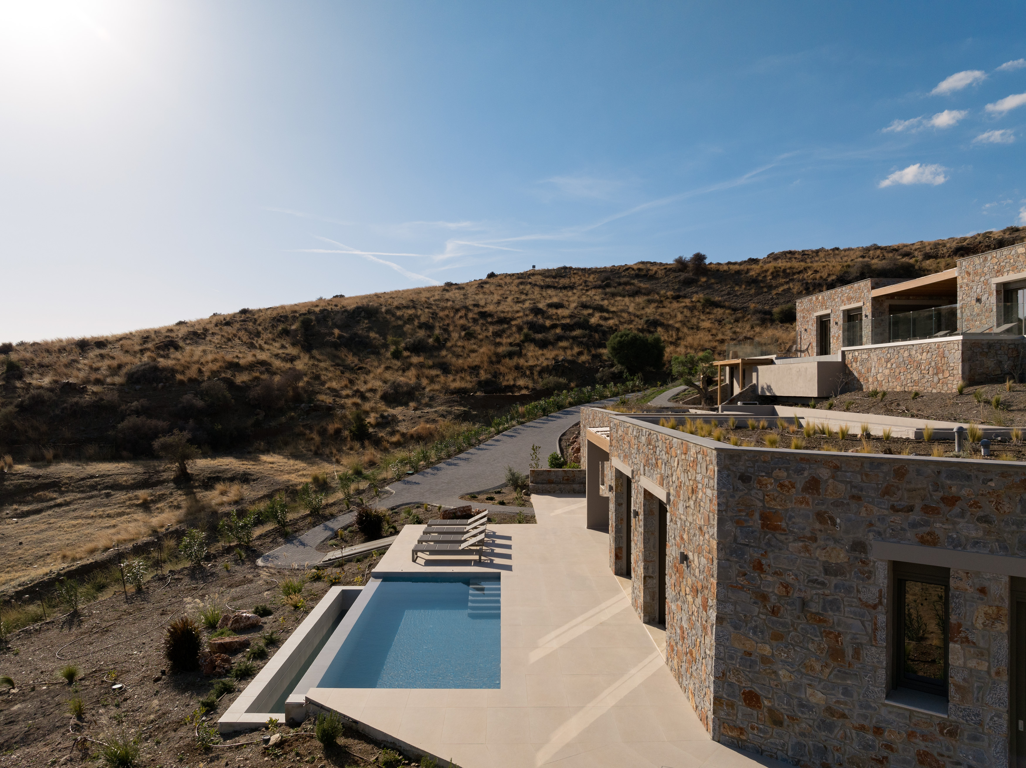 Stylish design, a sparkling pool, and cozy loungers – the perfect blend of luxury and relaxation