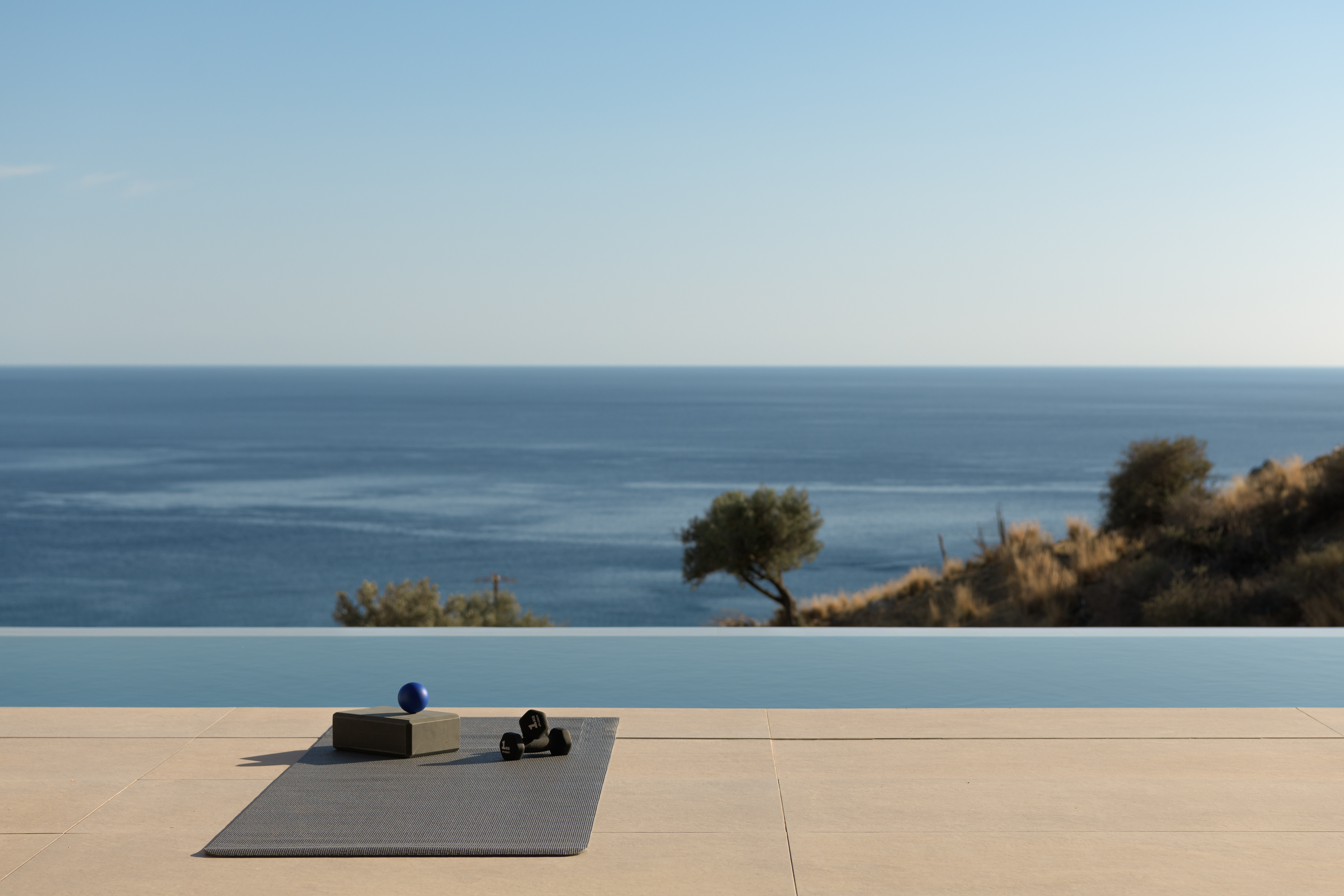 Unwind by the pool with breathtaking sea views, where tranquility meets wellness.
