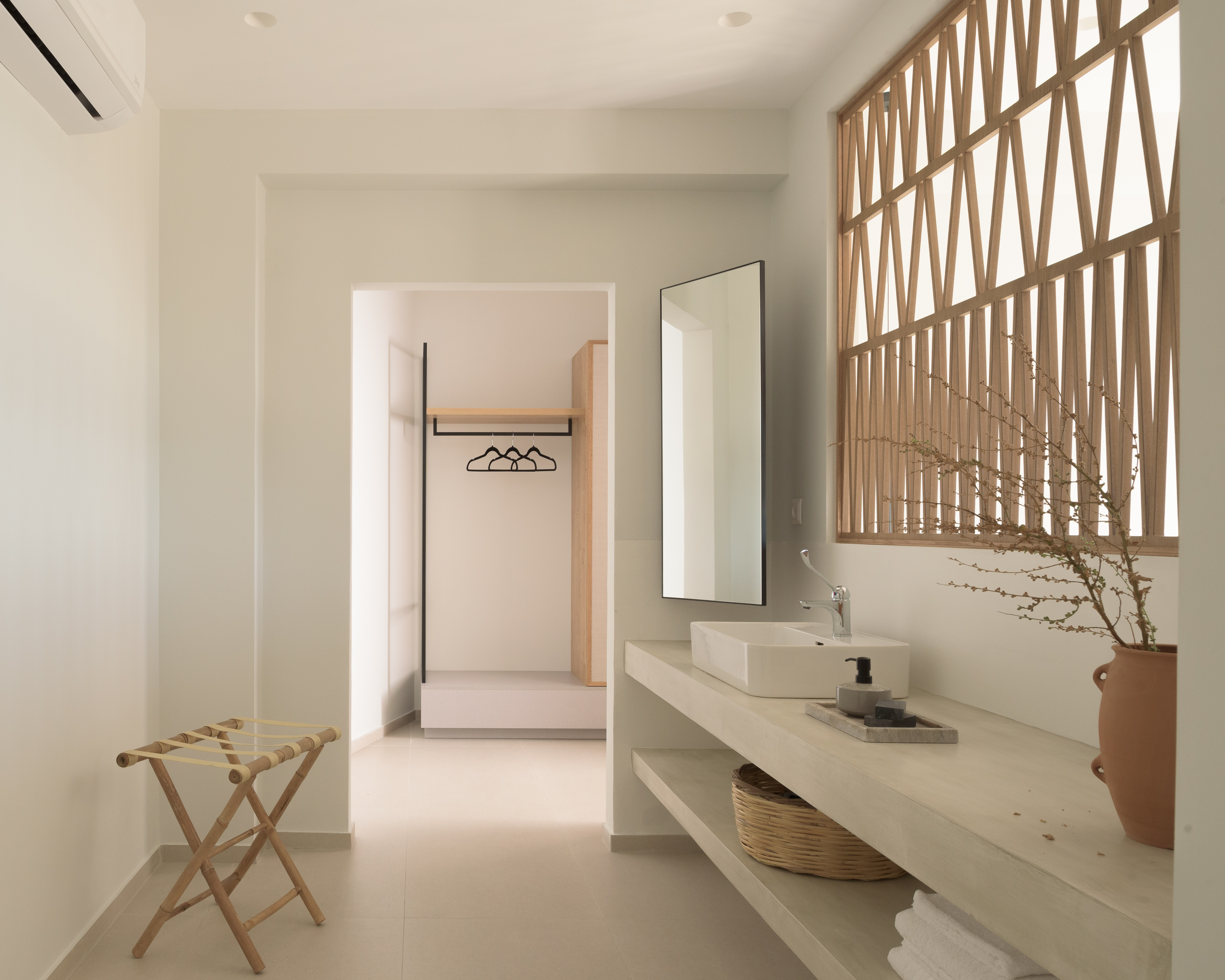 Elegant design and thoughtful details create a perfectly curated bathroom space.