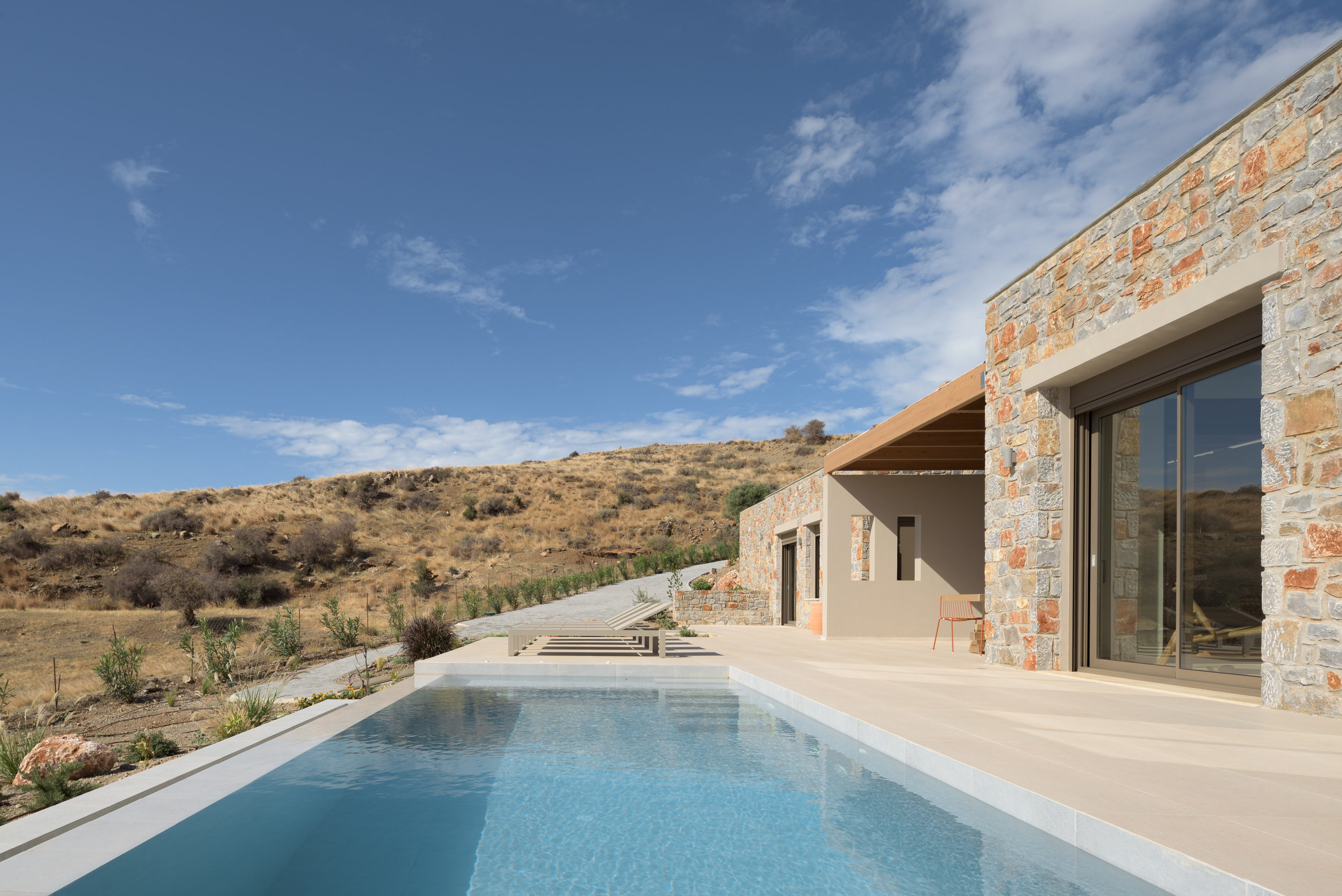 Unwind in style with sun loungers by the pool, the perfect spot to soak up the sun.